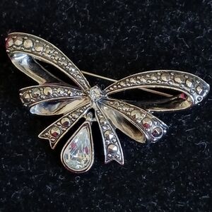 Vintage Avon silvertone bow brooch with clear pear shaped stone charm